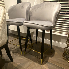 Pair Grey Upholstered Bar Stools, Black Metal Legs, Gold Footrest, Modern