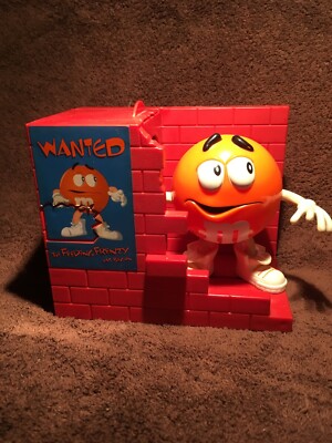 M&M Orange Dispenser ''Wanted - Feeding Frenzy Has Begun'' circa 1999