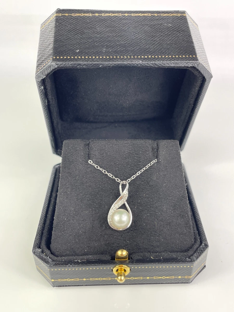 Diamond store swirl necklace