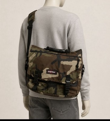 Eastpak Camo-pattern messenger bag. Padded shoulder strap and top handle
