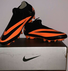 orange and black football boots