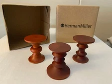 HERMAN MILLER:  miniature stools, full set of 3 designs, boxed.  Walnut color