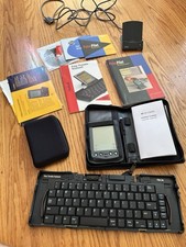 Palm Pilot Collectors Lot Includes Keyboard, Discs, Wallet, Booklets, PDA.