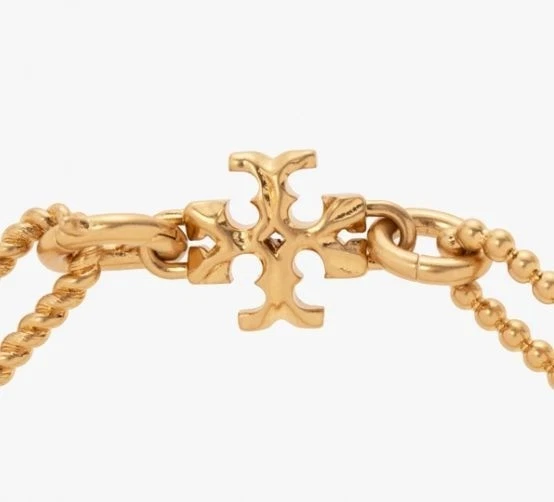 Brazalete de eslabones de cadena en tono dorado Tory Burch Roxanne con logotipo de firma Foto 2 de 4