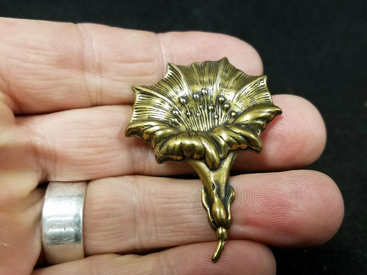 Brass brooch on sale