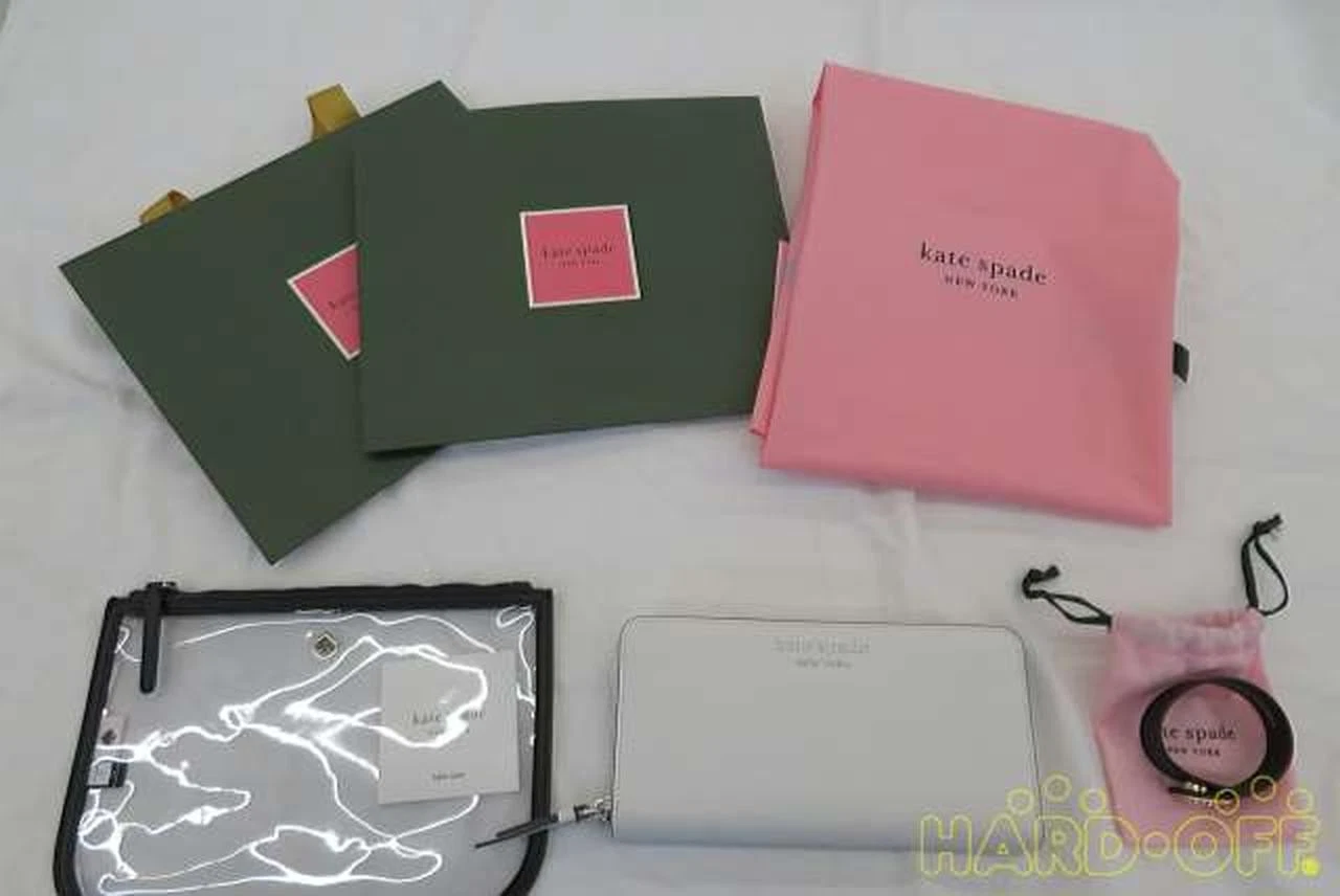 Portafoglio lungo modello marsupio trasparente con bracciale in pelle KATE SPADE