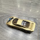 Hot Wheels Jaguar XJ220 * Color: Dorado metálico con gráficos azules y negros — photo 4
