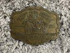Vintage Foreign and Domestic Gold Dealers Livingston Wells Co Brass Belt Buckle