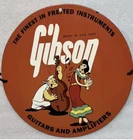 VINTAGE ART GIBSON GUITARS AND AMPLIFIER PORCELAIN PINUP GIRL GAS OIL PUMP SIGN.