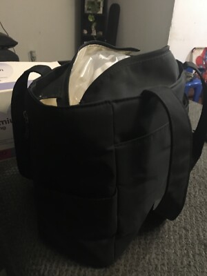 Medela Breastpump with all the fixings like bottles, storage bags, pads 