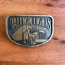 Vintage Raleigh Lights Brass Belt Buckle Big Rig Trucker 18 Wheeler 70s USA