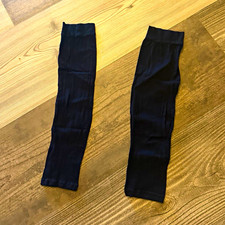 black seamless compression calf sleeves or arm sleeves made of nylon