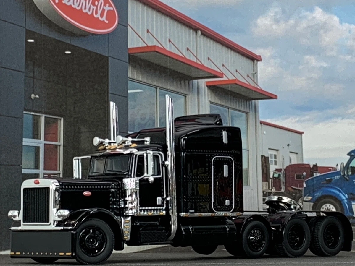 1/64 DCP BLACK PETERBILT 389 TRI AXLE W/ 63