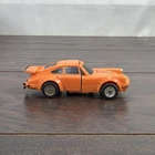 Vintage 1984 Bandai GoBots Puzzler Crossword Orange Porsche Transforming Car