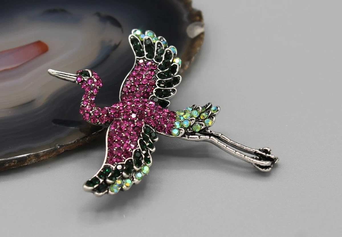 Crane brooch deals