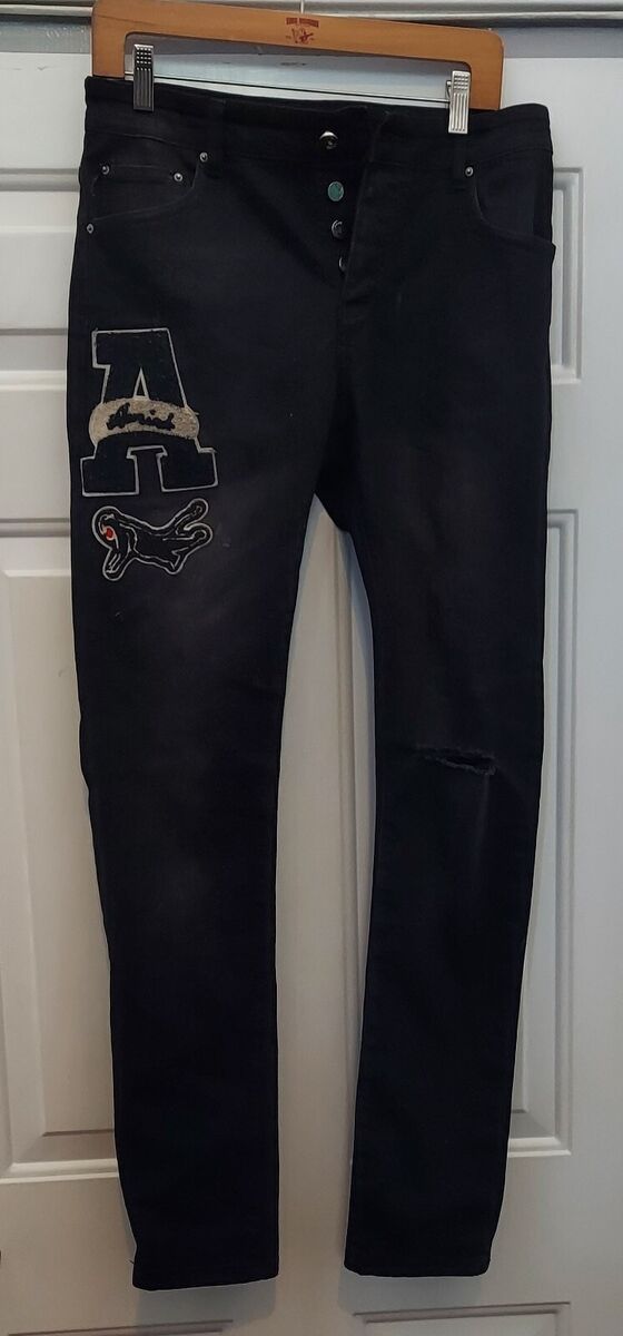 AMIRI VARSITY LOGO PATCH MEN'S DESTROYED BLACK SKINNY JEANS AMIRI VARSITY LOGO PATCH MEN'S DESTROYED BLACK SKINNY JEANS
