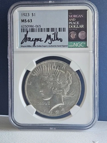 1923 LIBERTY PEACE DOLLAR $1 - NGC MS63 - WAYNE MILLER, AUTH SIGNED