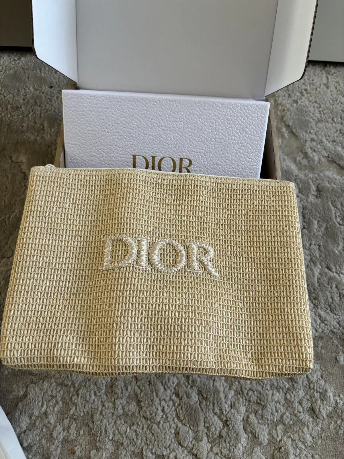 Pochette pochette maquillage Christian Dior en raphia 