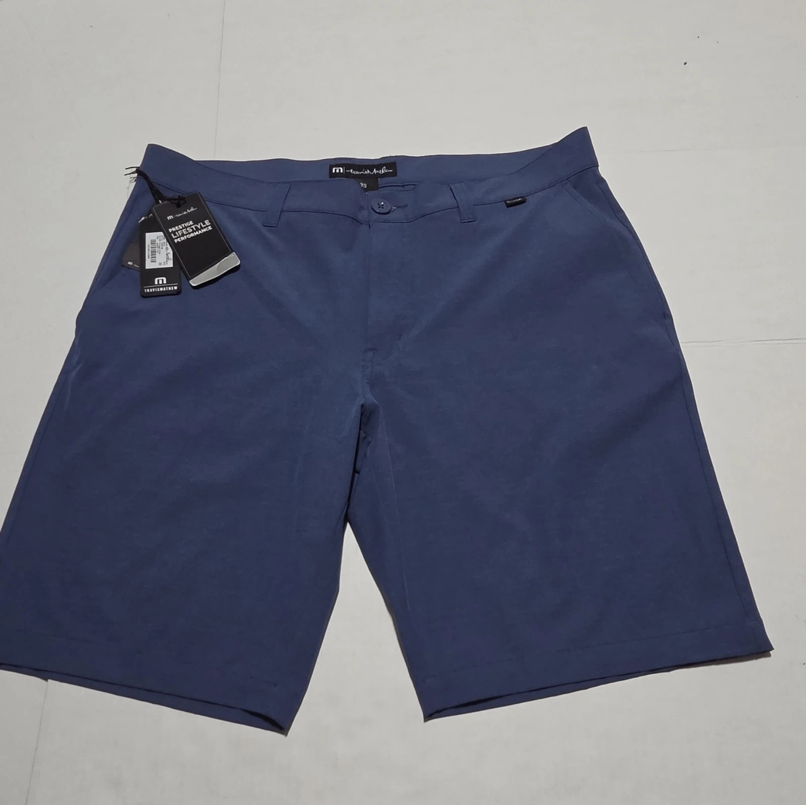 TravisMathew Men's Blue Solid Chino Shorts Flat Front Button Logo Pockets 10"