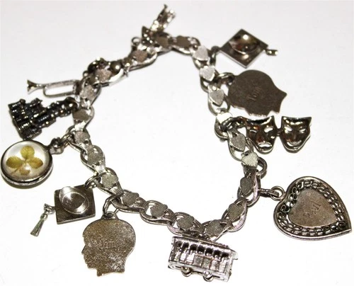 Beautiful vintage charm bracelet with some Sterling Silver charms Lot#320