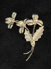 Broche vintage de plata esterlina con flor de tres estambres de cristal
