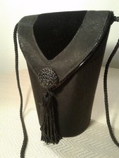 vintage black fancy dress purse w tassel..solid vase shape w glittering shine
