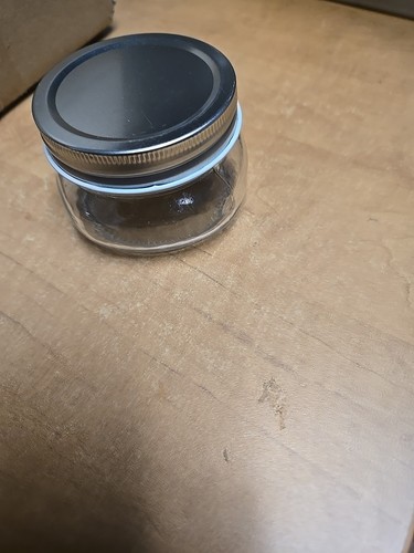 6 small mouth jars And lids
