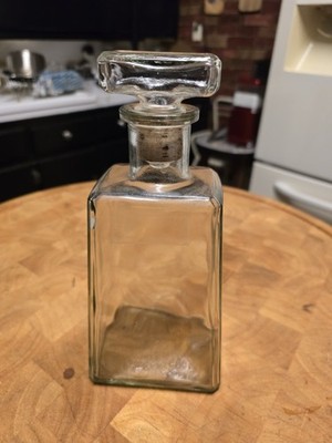 Jose Cuervo 1800 Reposado Tequila glass decanter bottle with a