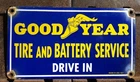 VINTAGE 1957 DATED GOOD YEAR TIRE BATTERY 12” PORCELAIN DRIVE IN GAS OIL SIGN