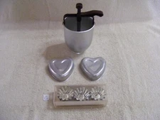 G) SAND BAKKEL MOLDS, ALUMINUM DONUT MAKER & TWO SMALL HEART SHAPED TINS
