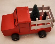 Christmas decoration, hand made wooden truck. Painted with rolling wheels.