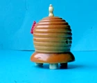 ANTIQUE  BEEHIVE FOOTED SEWING CARVED TAGUA NUT TAPE MEASURE.