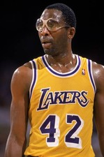 James Worthy Los Angeles Lakers stands on the court at an NBA game- Old Photo
