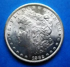 1882-CC MORGAN SILVER DOLLAR. UNCIRCULATED. HIGH GRADE.
