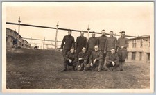 Vtg B&W Snapshot Group Of 10 Men In Military Uniforms Outside Wood Barracks