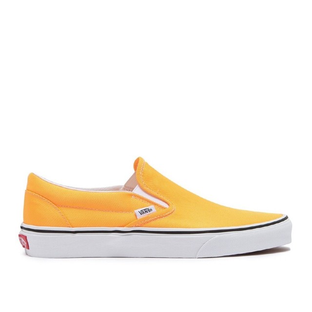 orange and white slip on vans