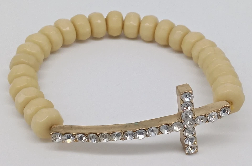 Pulsera elástica con cuentas cruzadas de diamantes de imitación beige acrílico tono dorado metal religioso Foto 2 de 4