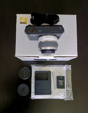 Nikon 1 J1 Digital Camera 10-30mm Lens Boxed VGC