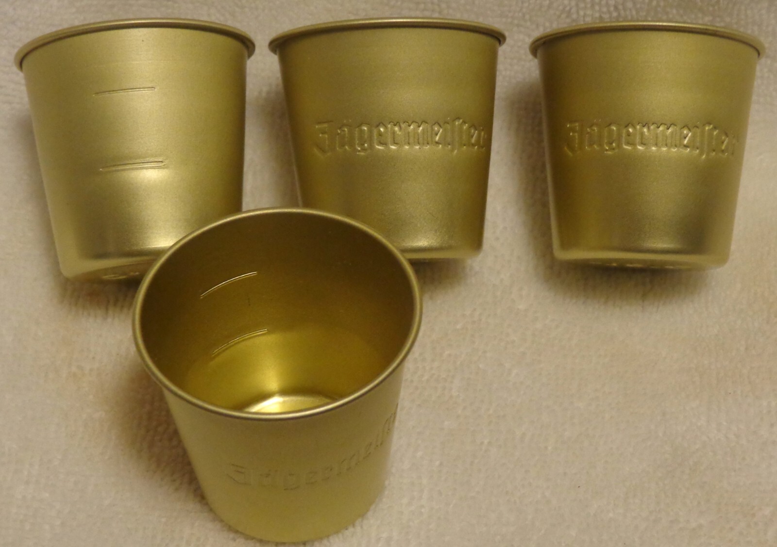 (4) Jagermeister metal Shot Glasses...Raised Lettering...NEW eBay