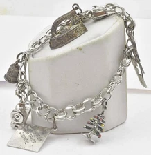 Vintage Sterling Silver 7 different flat & 3 Dimensional Charms Ladies Bracelet