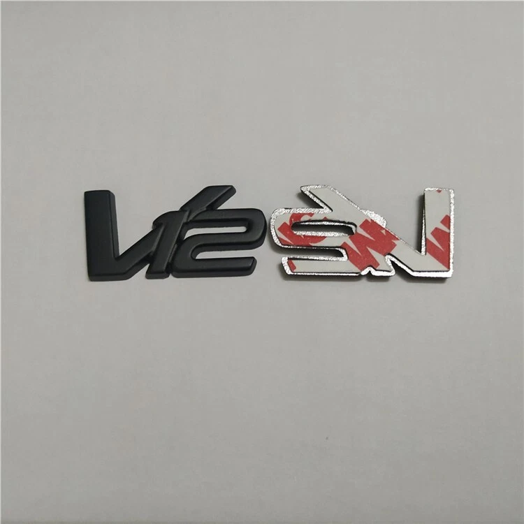 Insignia emblema Aston Martin V12 metal negro mate AD23-43548-DA (1 PIEZA Foto 2 de 2