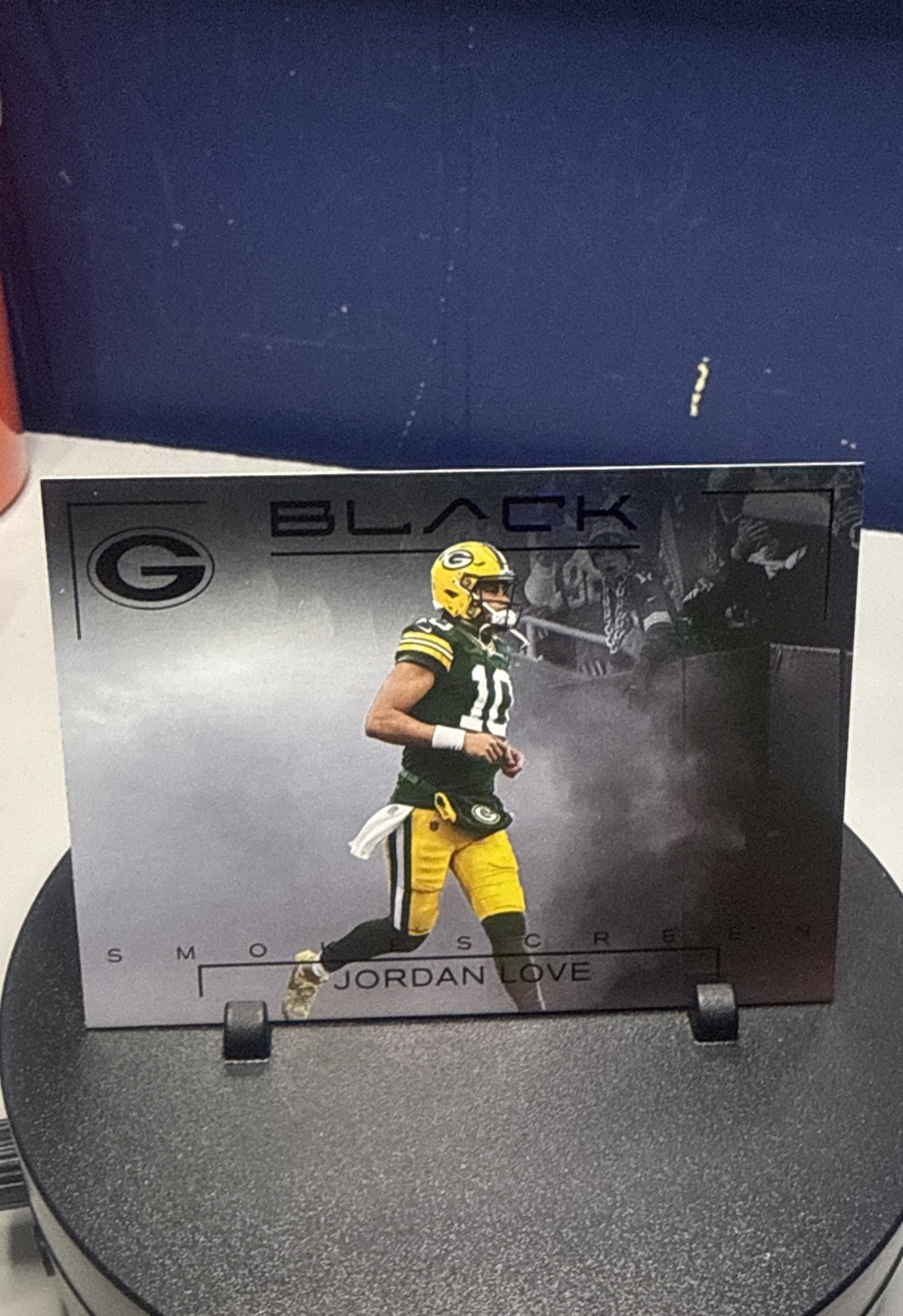 Jordan Love #12 Football Cards 2025 Panini Black Smokescreen trading card — raw and PSA graded price guide