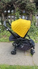 Bugaboo Bee 6 All-Black Stroller with Yellow Hood and Bumper Bar