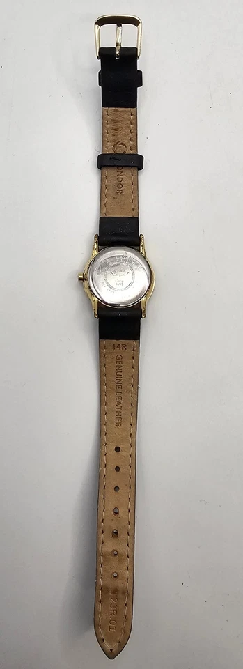 Reloj de cuarzo giratorio para mujer tono dorado correa de cuero genuino negro esfera romana Foto 3 de 4