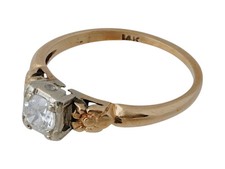 A vintage 14K yellow gold engagement ring. Set with a round-cut Diamond, 3.1 grm