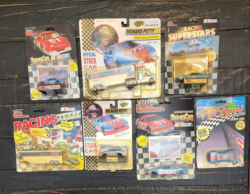 Richard Petty Diecast Collection Lot of 5 Petty cars, 2 Race Team Semis.