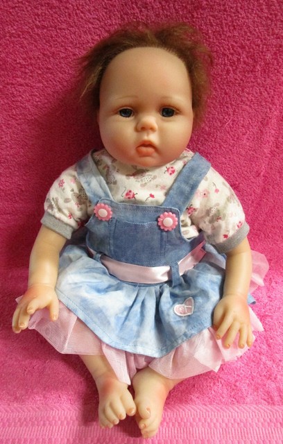 doll with brown hair and blue eyes