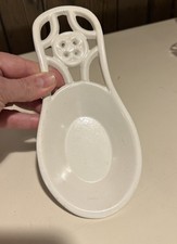 White metal cast iron spoon rest for the oven...