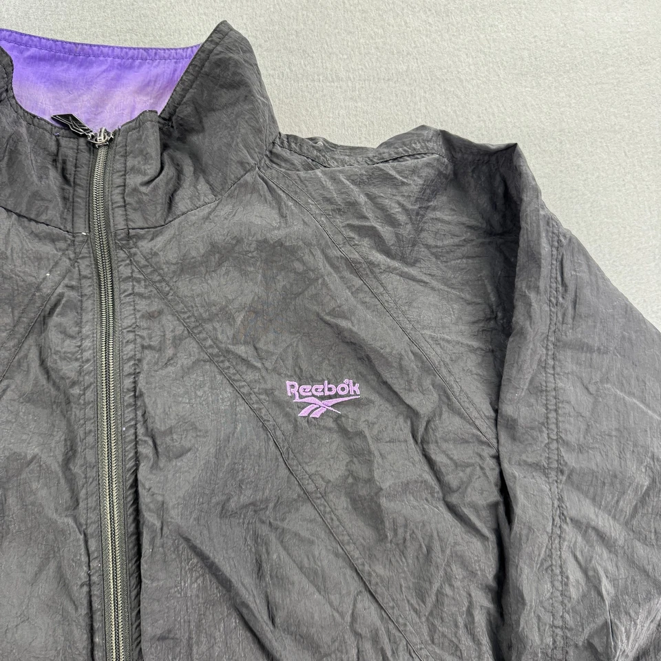 Chaqueta cortavientos vintage Reebok para hombre XL negra púrpura nailon cremallera completa años 90 retro Foto 2 de 4