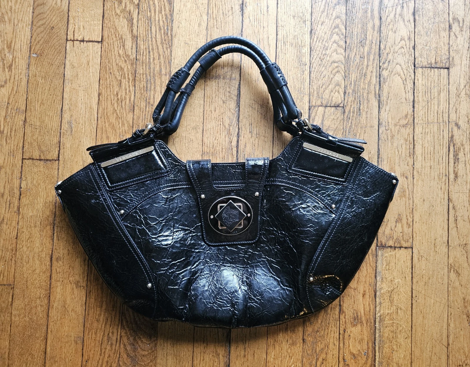 Versace — Vintage Versace La Medusa Black Leather Handbag With Square Turning Closure